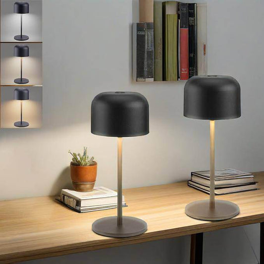 Dimmable LED Battery Table Lamp on a desk with a minimalist design, showcasing different lighting modes.