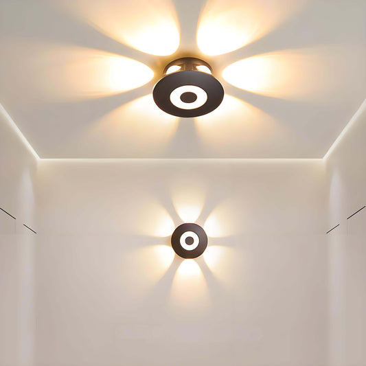 LED ceiling lights casting circular patterns on the wall, showcasing stylish indoor lighting with modern design.