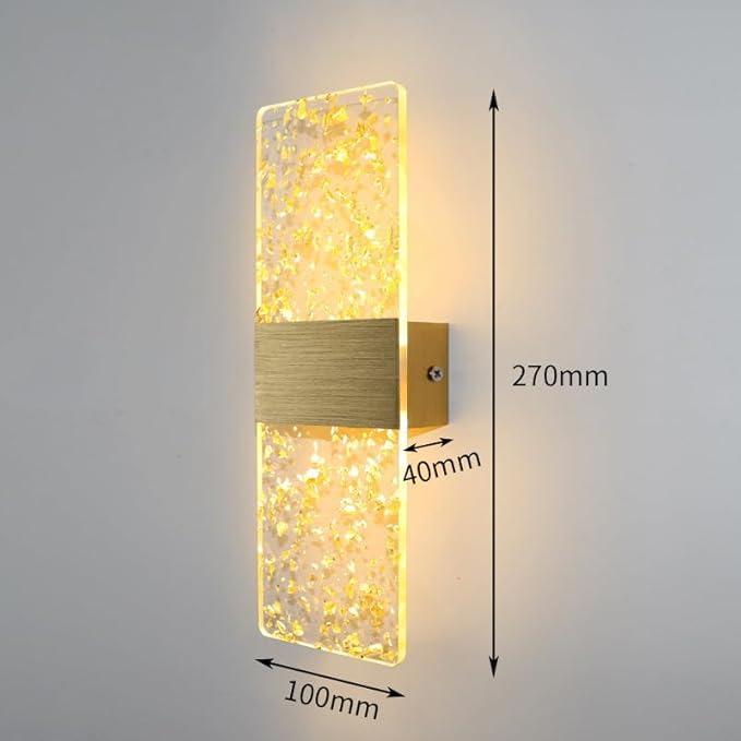 High-end LED wall lamp featuring a gold-accented acrylic cover and brushed aluminum base in warm lighting.