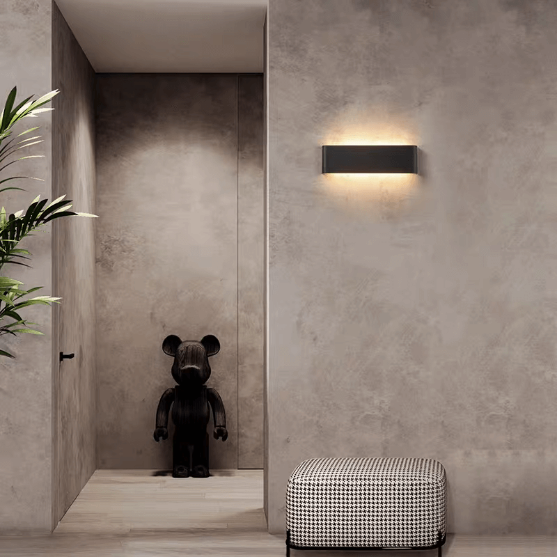 Modern LED strip light illuminating a stylish hallway with a decorative bear figure and minimalist decor.