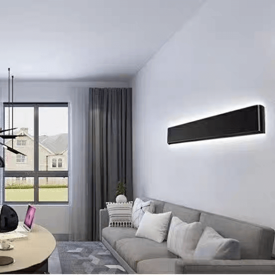Modern LED strip light mounted on a wall in a stylish living room with a gray sofa and large window.