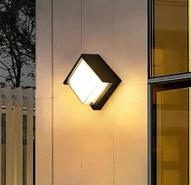 Modern minimalist outdoor LED wall light on a facade, providing stylish and waterproof exterior illumination.