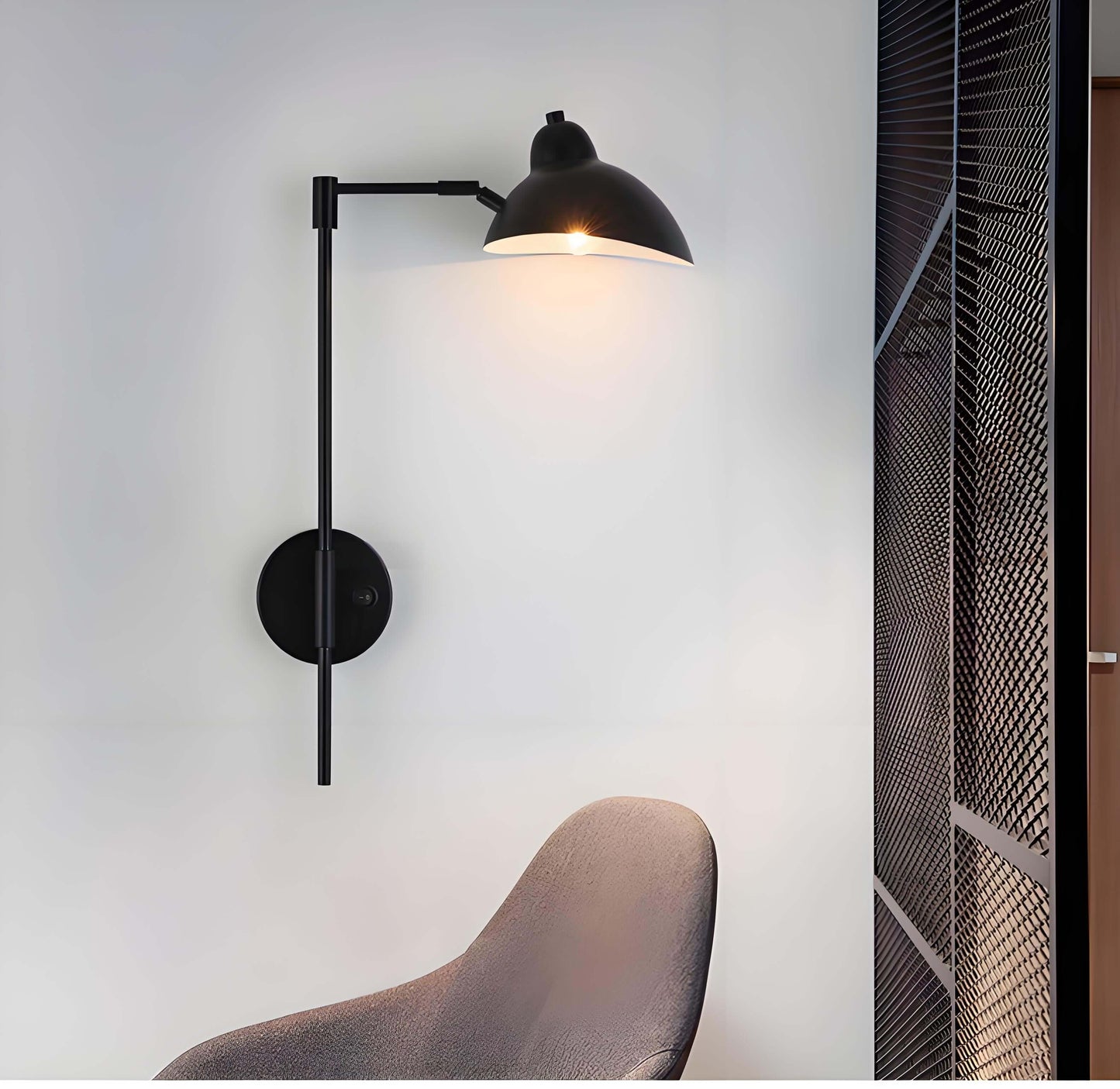 Vintage black metal swing arm wall lamp with adjustable shade, perfect for reading and ambient lighting.
